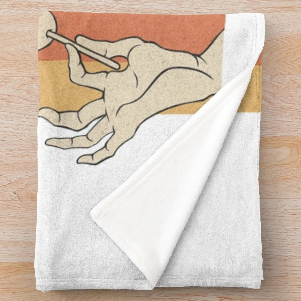 Barong-inspired plush blanket featuring traditional Balinese art