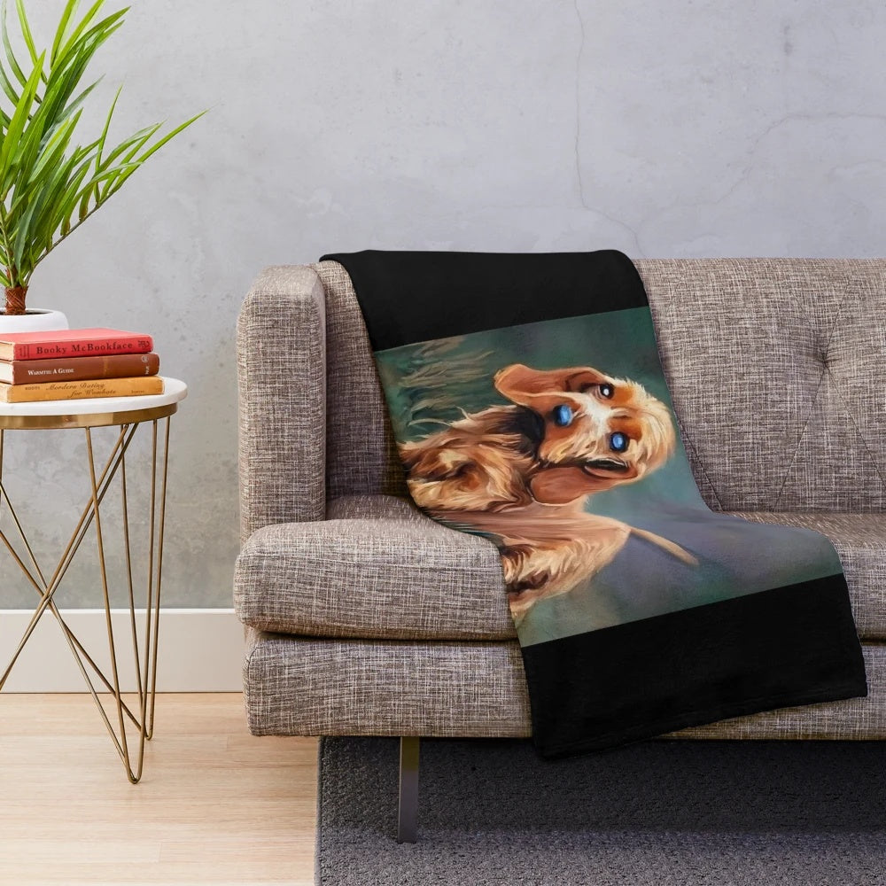 Basset Fauve de Bretagne dog portrait on a plush blanket