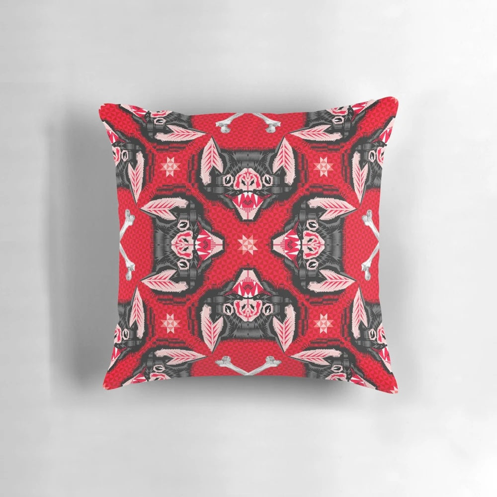 A throw pillow featuring a geometric bat head pattern in black and red, perfect for gothic and vampire-themed home decor.