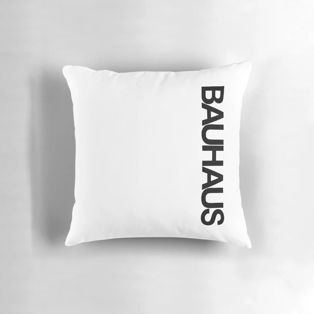 Minimalist Bauhaus-inspired pillow with geometric white design