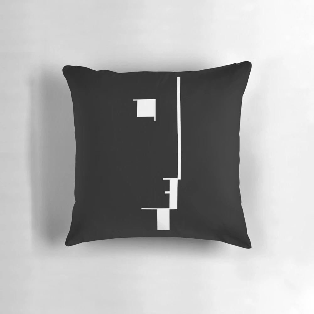 Black and white Bauhaus-inspired pillow featuring a minimalist profile design
