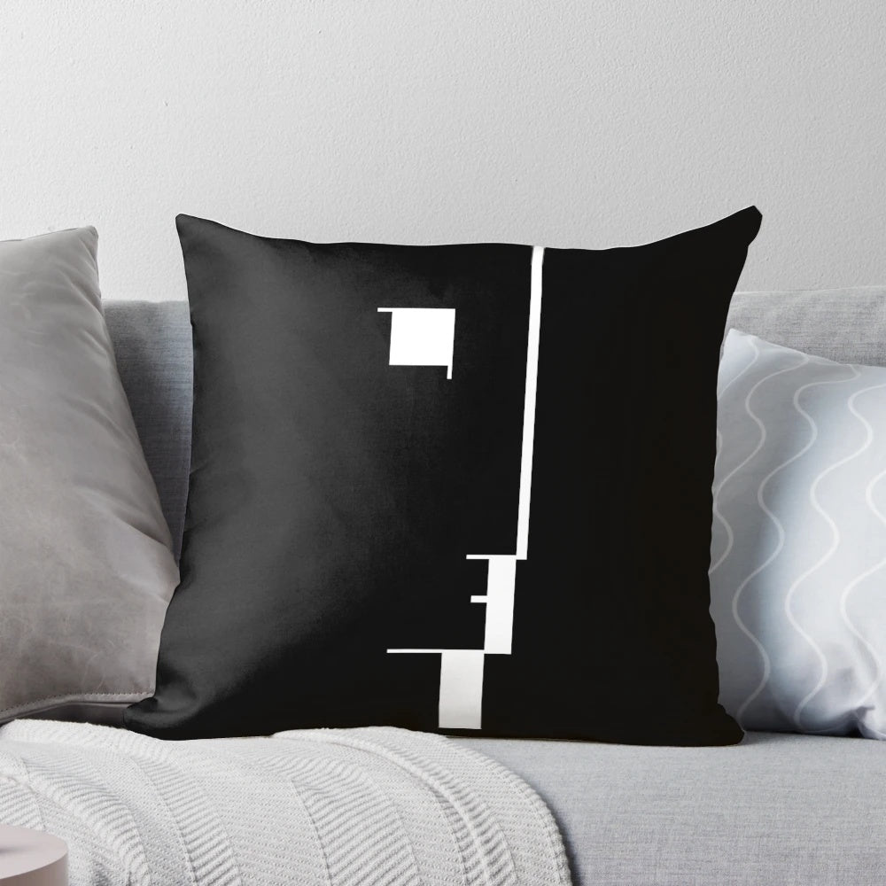 Black and white Bauhaus-inspired pillow featuring a minimalist profile design