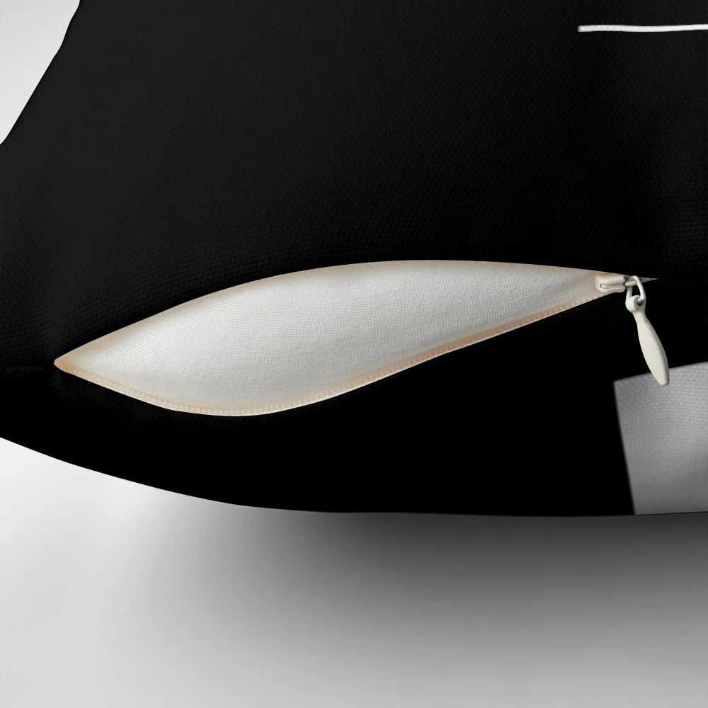 Black and white Bauhaus-inspired pillow featuring a minimalist profile design