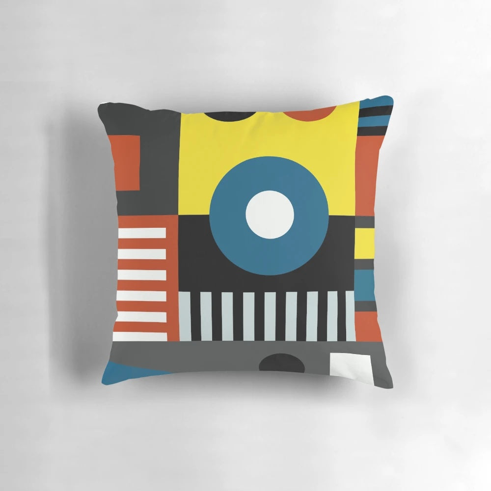 Bauhaus-inspired pillow with vibrant geometric design in bold colors