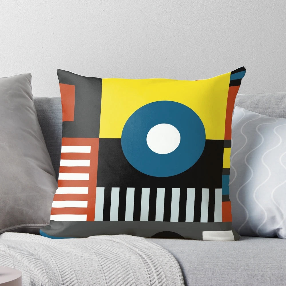 Bauhaus-inspired pillow with vibrant geometric design in bold colors