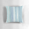 Beaching watercolor beach pillow with blue, turquoise, and white striped design