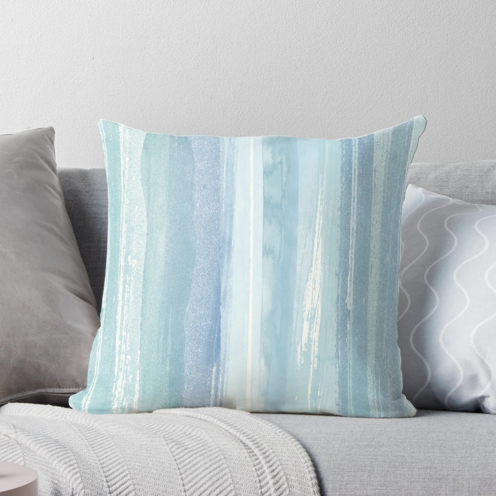 Beaching watercolor beach pillow with blue, turquoise, and white striped design