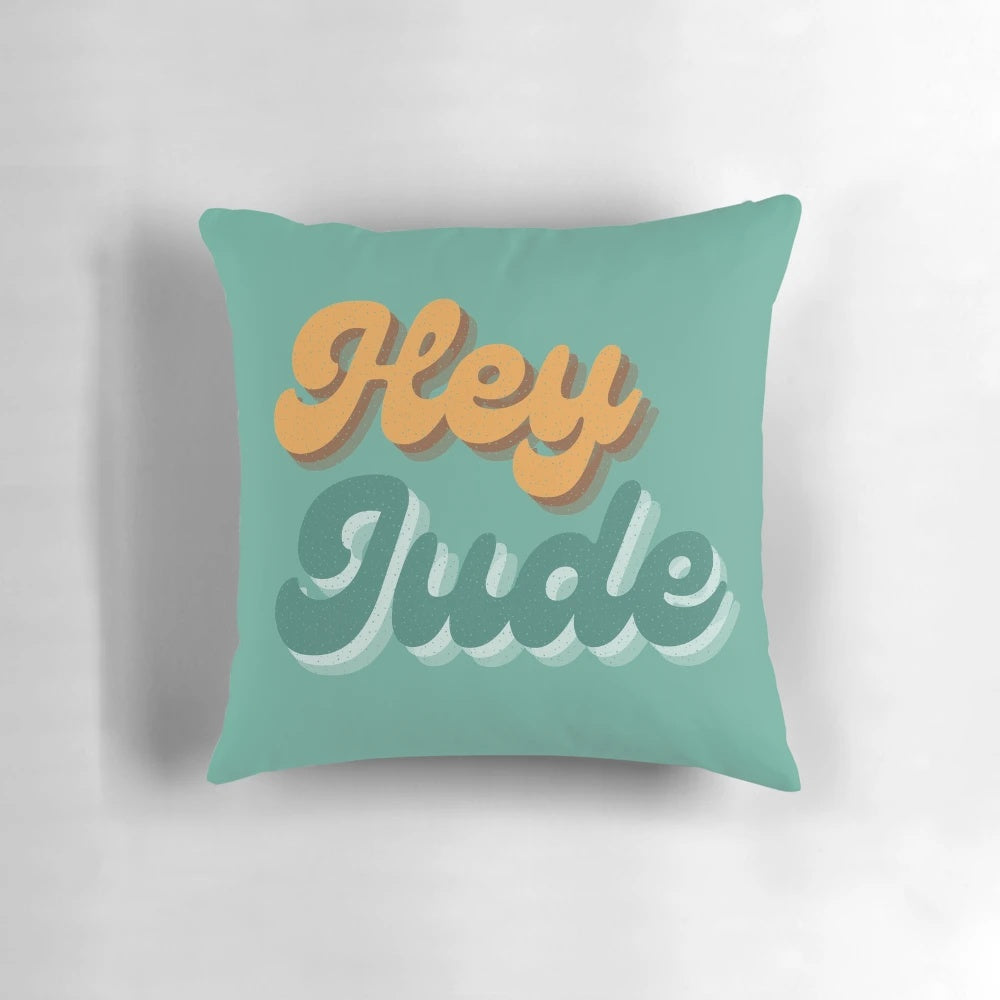 Vibrant blue and yellow "Hey Jude" themed retro pop art pillow