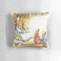 Beatrix Potter inspired Benjamin Bunny pillow depicting a rabbit family in their cozy burrow home.