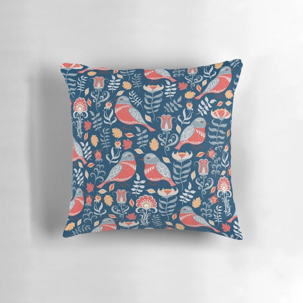 Vibrant pillow featuring a colorful birds and flowers floral ornament in a traditional folk art style.