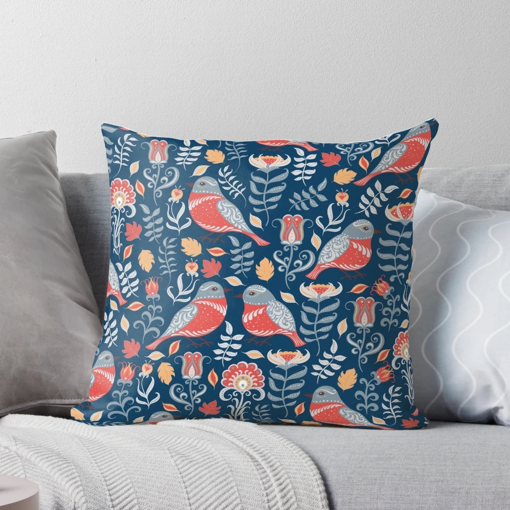 Vibrant pillow featuring a colorful birds and flowers floral ornament in a traditional folk art style.