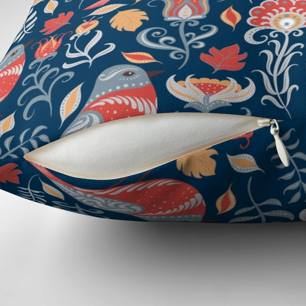 Vibrant pillow featuring a colorful birds and flowers floral ornament in a traditional folk art style.