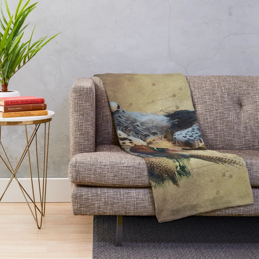 Plush blanket with artwork of an English setter hunting dog and pheasants