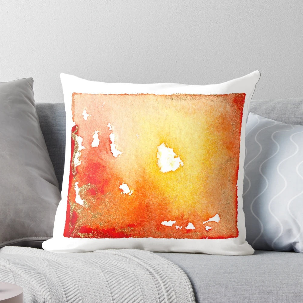 Vibrant abstract watercolor painting in red, orange, and gold tones on a decorative throw pillow design.