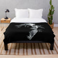 Beetlejuice-themed plush blanket featuring gothic and pop art design