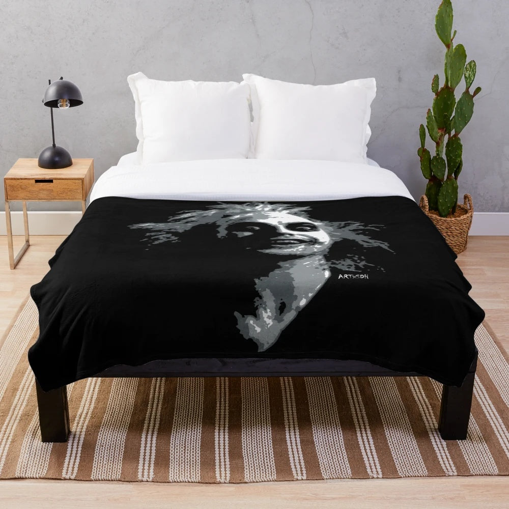 Beetlejuice-themed plush blanket featuring gothic and pop art design