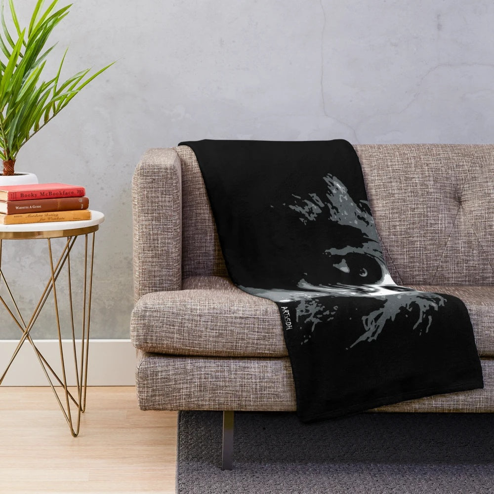 Beetlejuice-themed plush blanket featuring gothic and pop art design