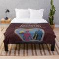 Beetlejuice-inspired plush blanket with "Handbook for the Recently Deceased" design