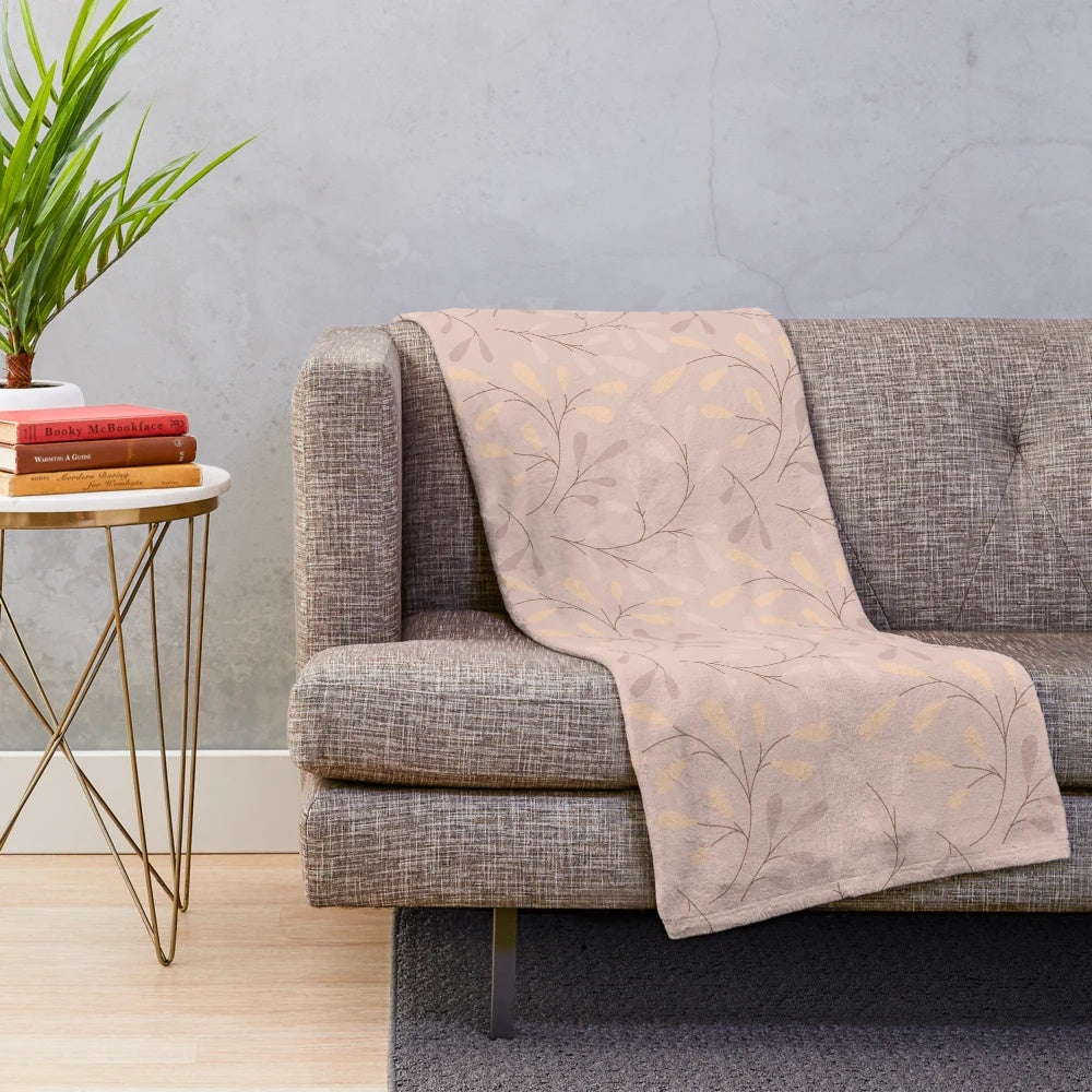 Beige plush blanket with leafy botanical design