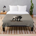 Belted Galloway cow plush blanket in black and white