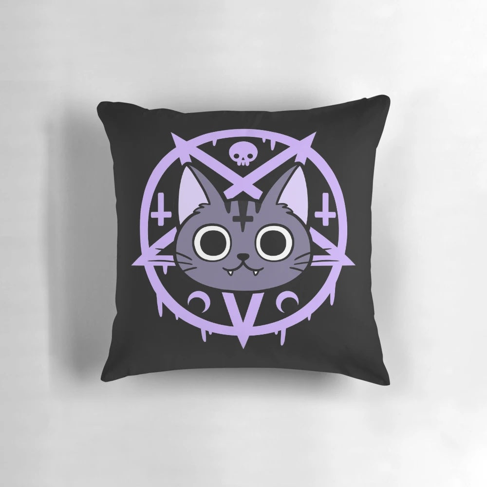 A black cat pillow featuring a whimsical, witchy design by Nikury