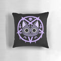 A black cat pillow featuring a whimsical, witchy design by Nikury