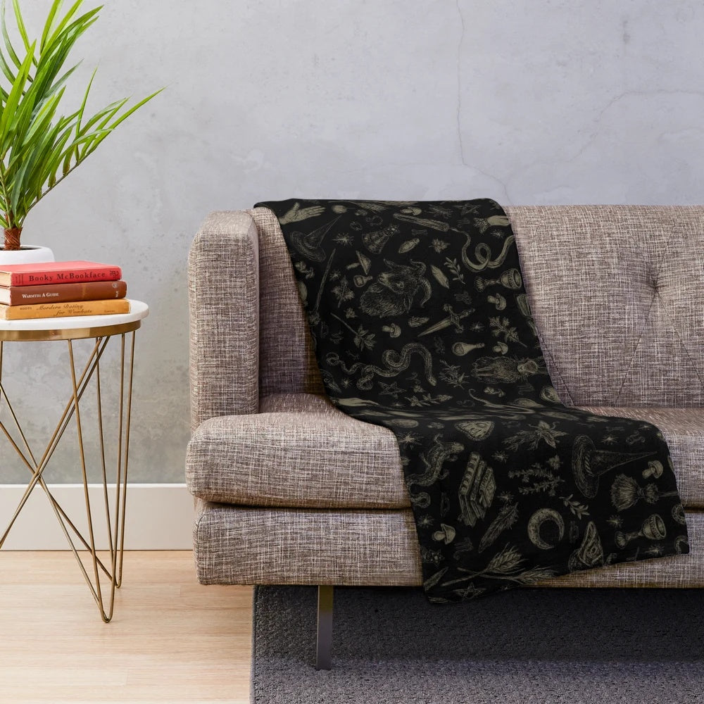 Cozy plush blanket with witch-themed design