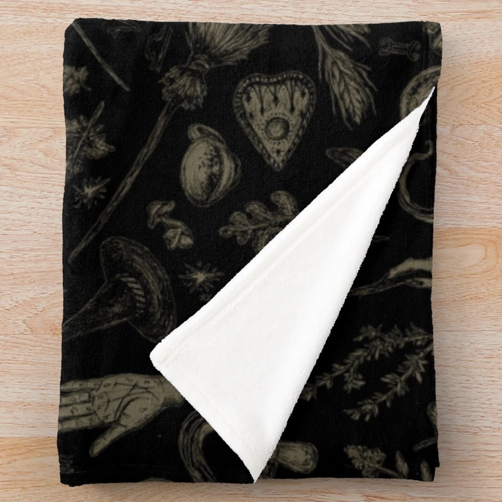 Cozy plush blanket with witch-themed design