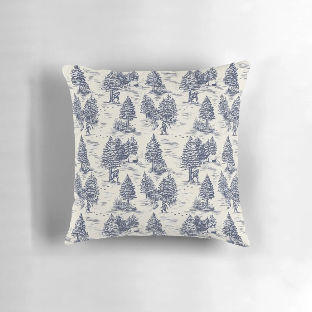 Throw pillow featuring a blue and white Toile de Jouy style pattern with a Bigfoot/Sasquatch design