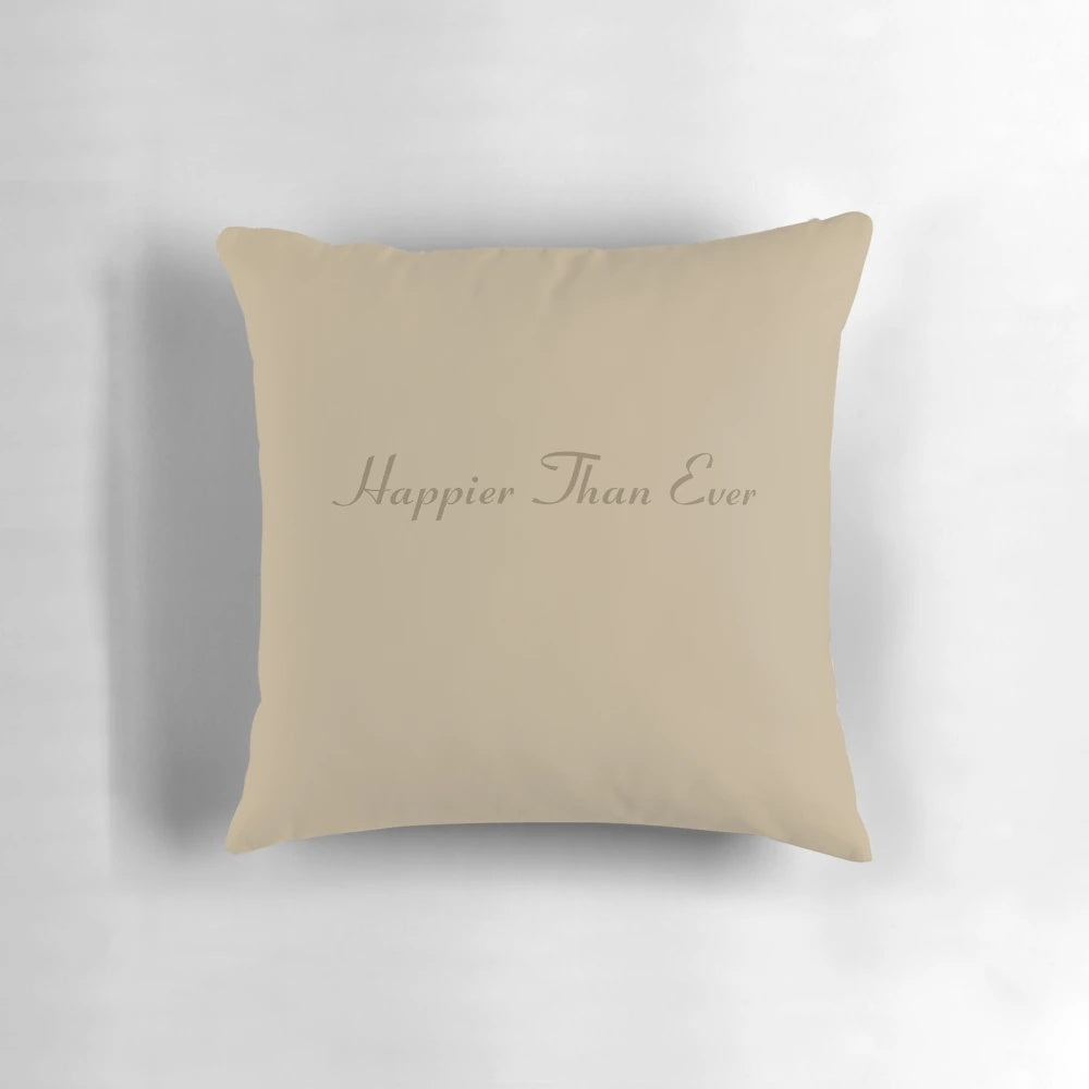 A cozy and stylish pillow featuring lyrics and art inspired by Billie Eilish's album 'Happier Than Ever