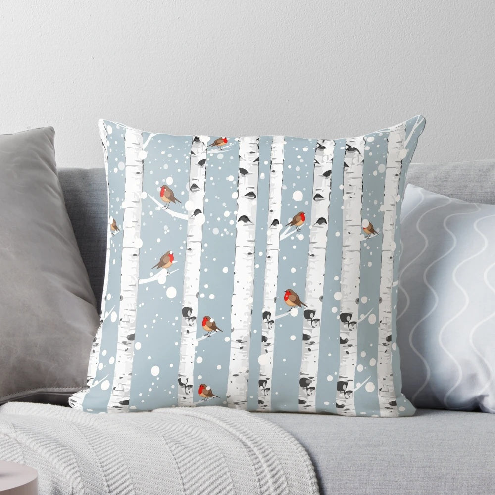 Cozy pillow featuring a snowy birch tree forest with a red-breasted robin bird, perfect for nature enthusiasts