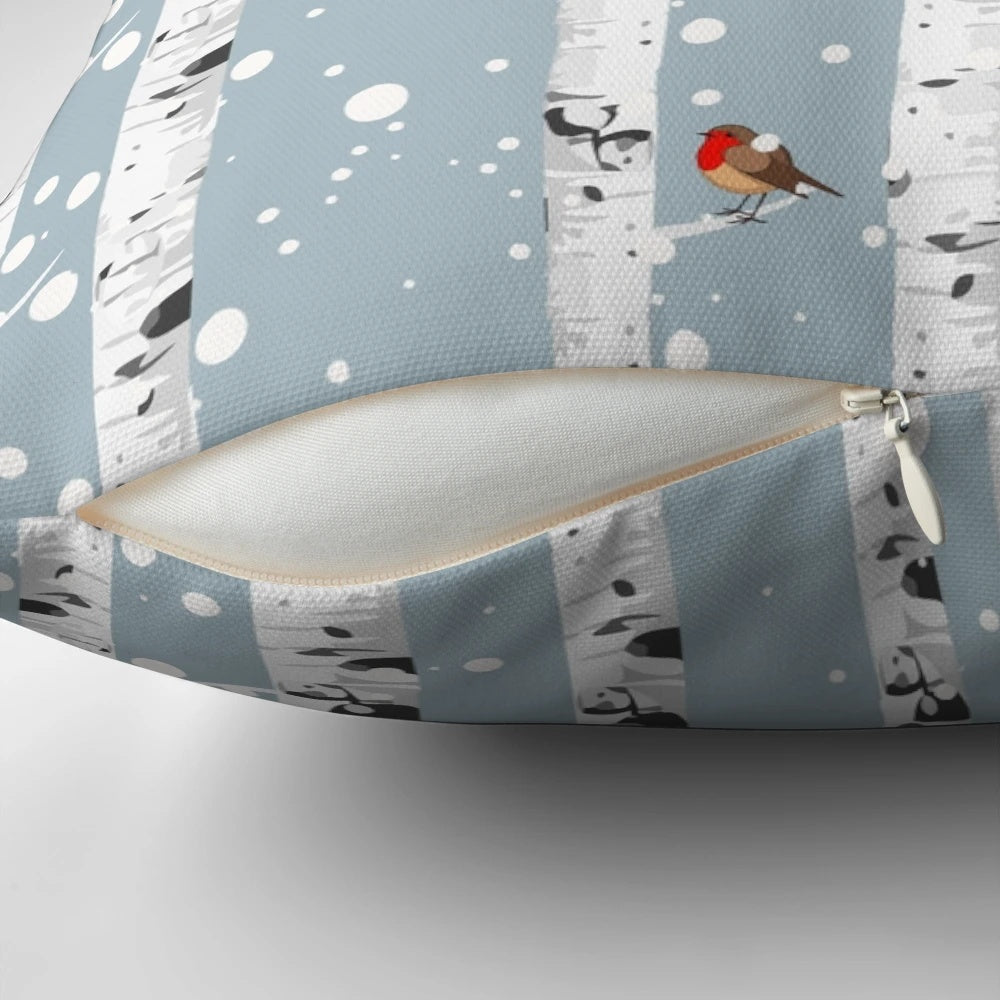Cozy pillow featuring a snowy birch tree forest with a red-breasted robin bird, perfect for nature enthusiasts