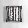 Pillow featuring a snowy forest scene with birch trees and a red-breasted bird
