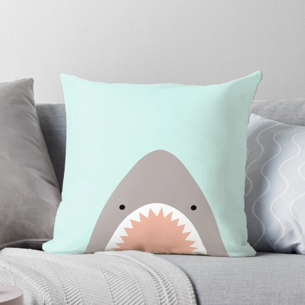 Soft, plush decorative pillow featuring a playful shark design, perfect for adding a touch of the sea to any space.