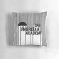 Black and white graphic design inspired by The Umbrella Academy logo on a decorative throw pillow
