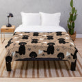Black Labradoodle on a plush, cozy blanket