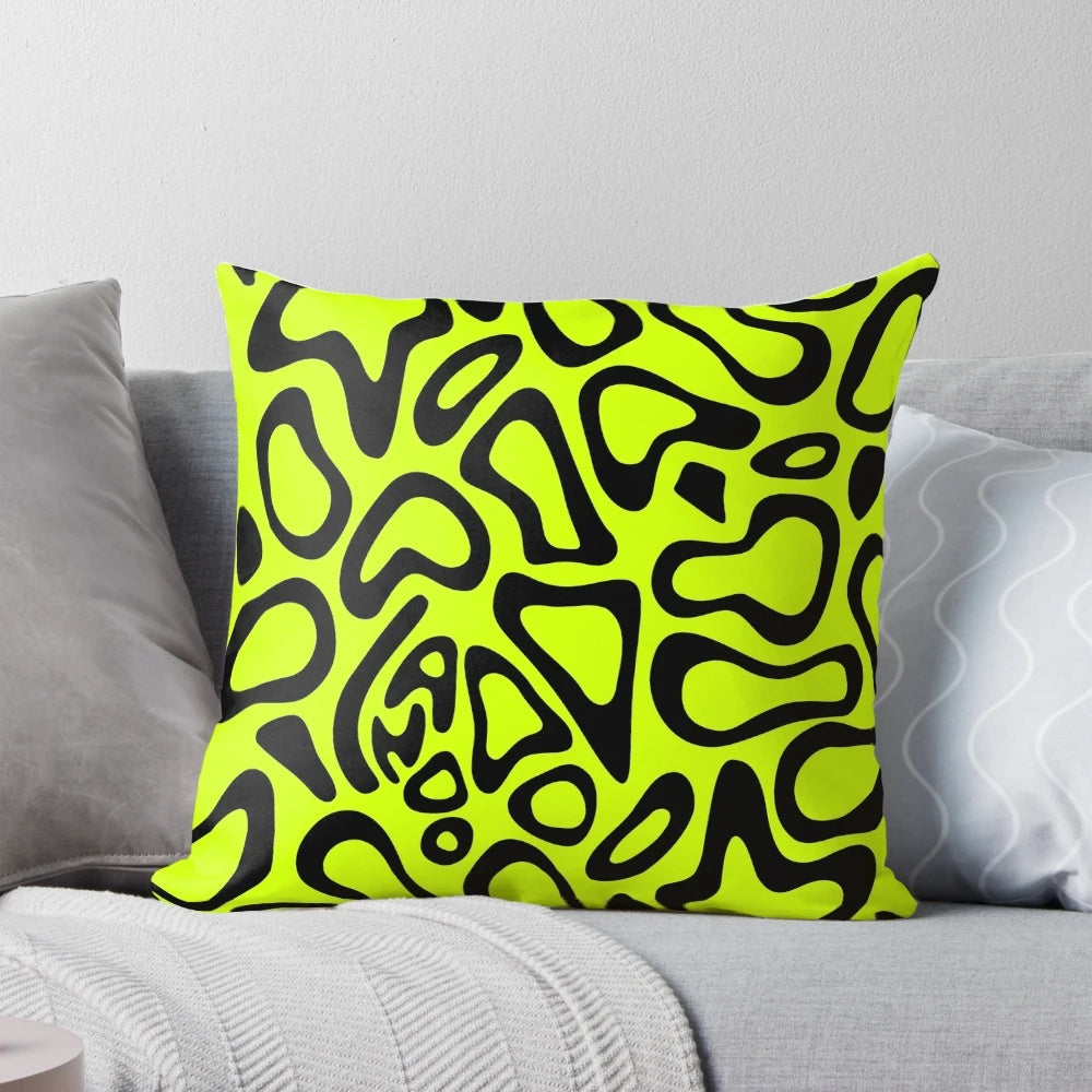 Black decorative pillow featuring a stylized pattern inspired by Lando Norris' Formula 1 helmet