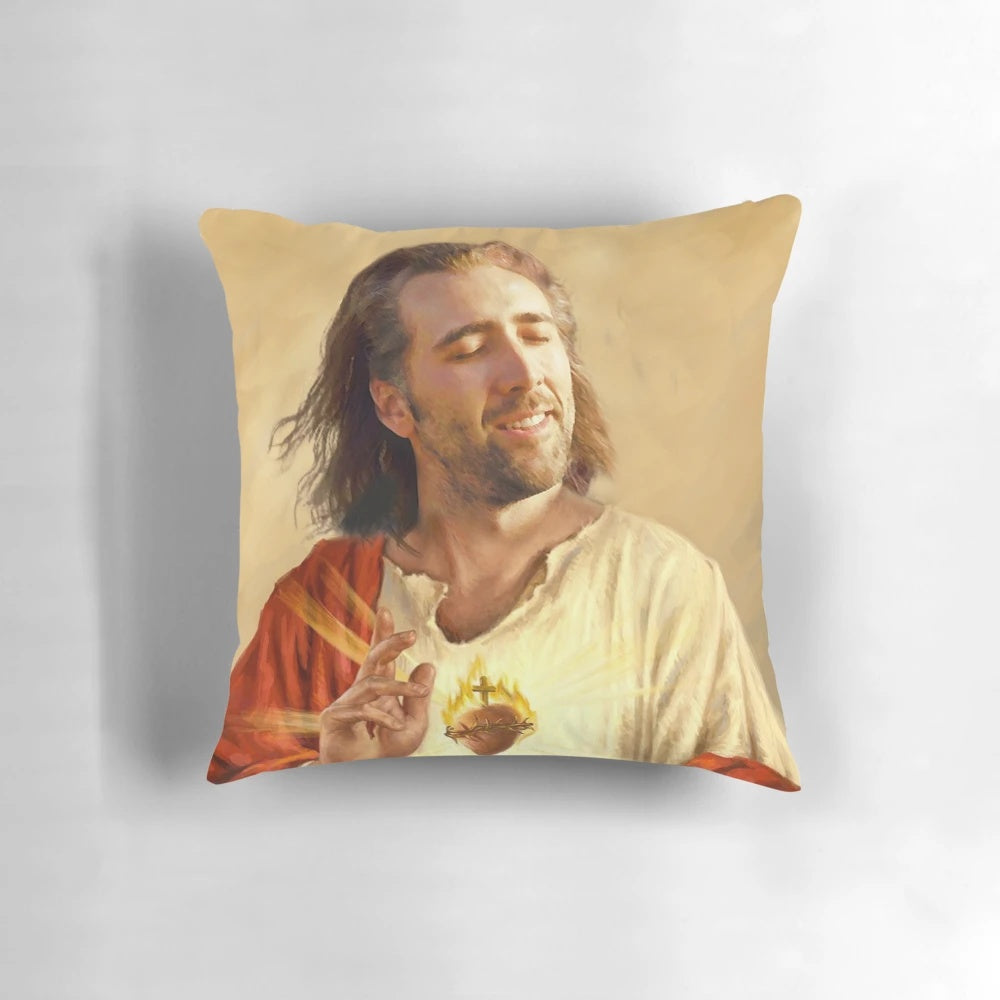 A pillow featuring an image of Nicholas Cage with a blessing or sacred heart