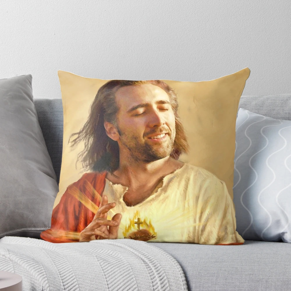 A pillow featuring an image of Nicholas Cage with a blessing or sacred heart