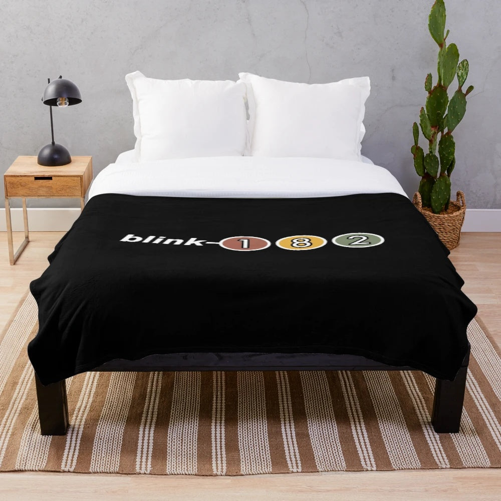 Blink-182 inspired plush blanket with blinking eyes design