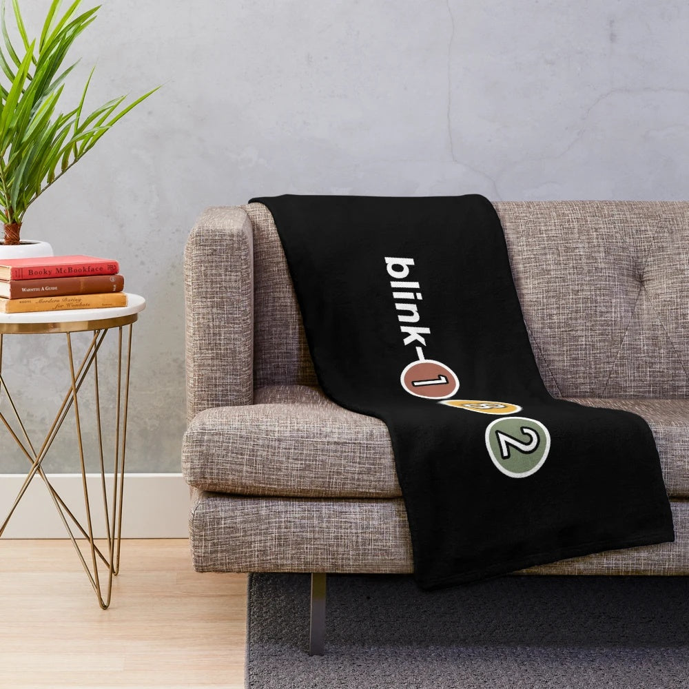Blink-182 inspired plush blanket with blinking eyes design