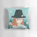 A vibrant pillow featuring a Welsh lady with a Blodyn Tatws (Welsh Lady) design, showcasing the beauty and heritage of Wales.