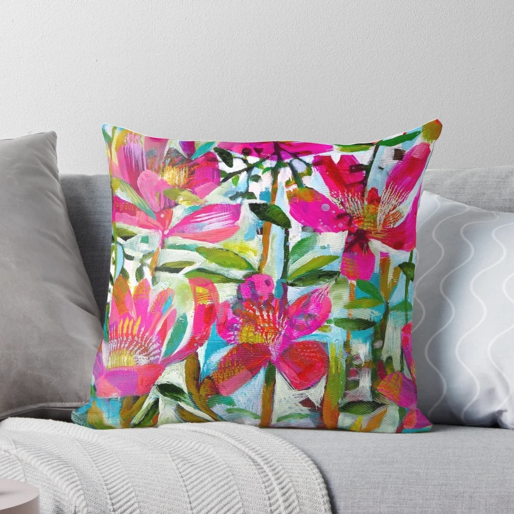 A vibrant and feminine floral pillow featuring a beautiful bouquet of summer roses in shades of pink.
