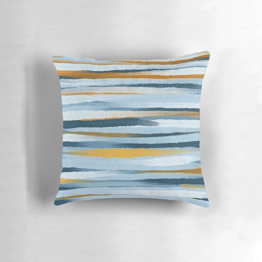 A blue and yellow minimalist throw pillow with abstract lines and geometric patterns