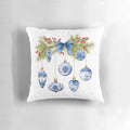 Blue chinoiserie-inspired decorative Christmas pillow with berries, pine branches, and bow
