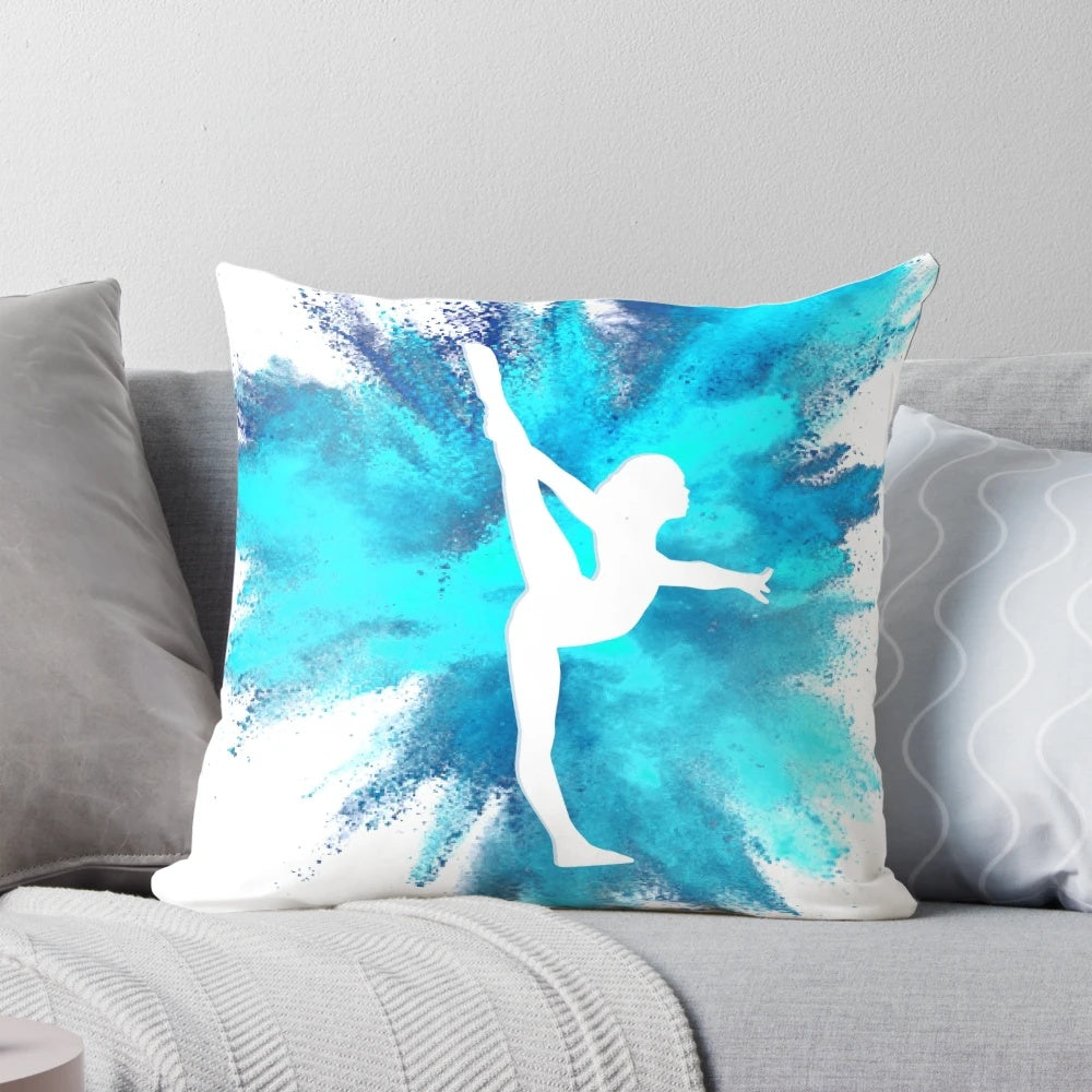 Blue and white explosion design on a decorative pillow featuring a gymnast silhouette