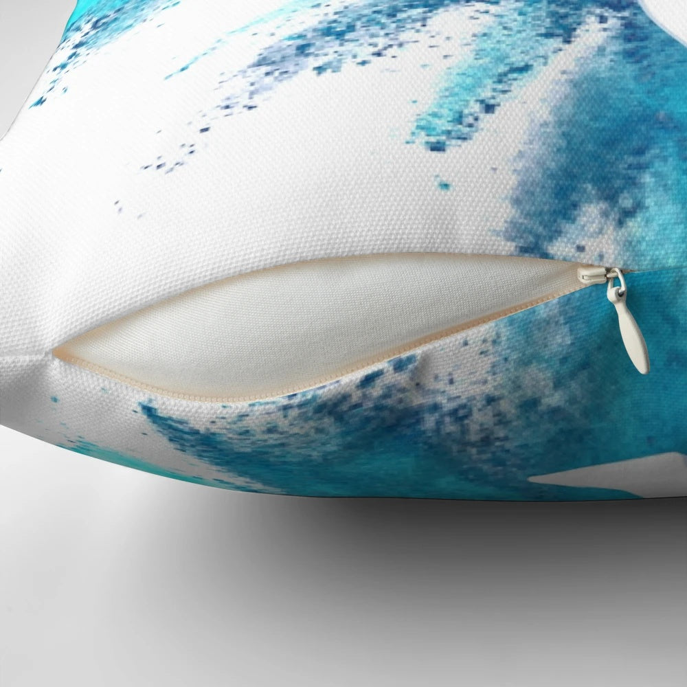 Blue and white explosion design on a decorative pillow featuring a gymnast silhouette