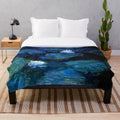 Blue and white floral plush blanket featuring Monet's water lilies painting
