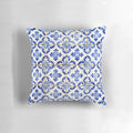 Blue and white floral patterned throw pillow with Portuguese tile design