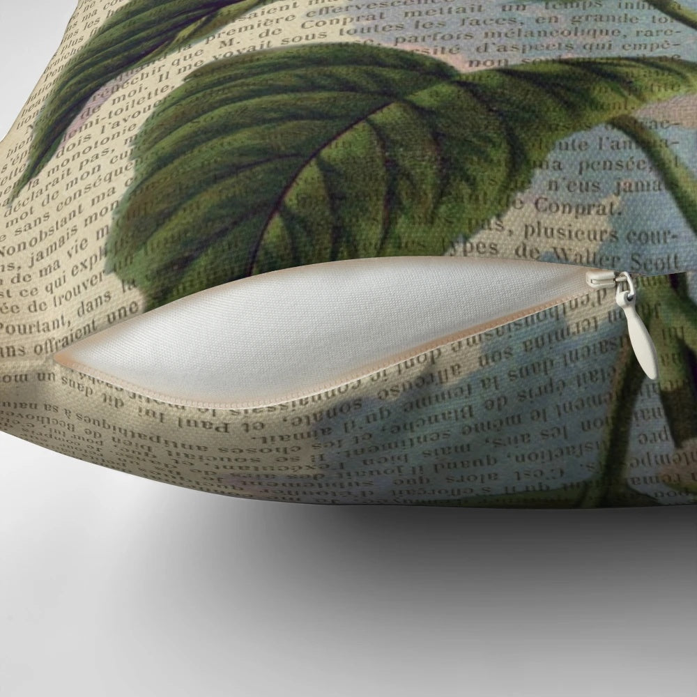 Blue hydrangea flowers printed on an aged, vintage book page, decorative pillow.